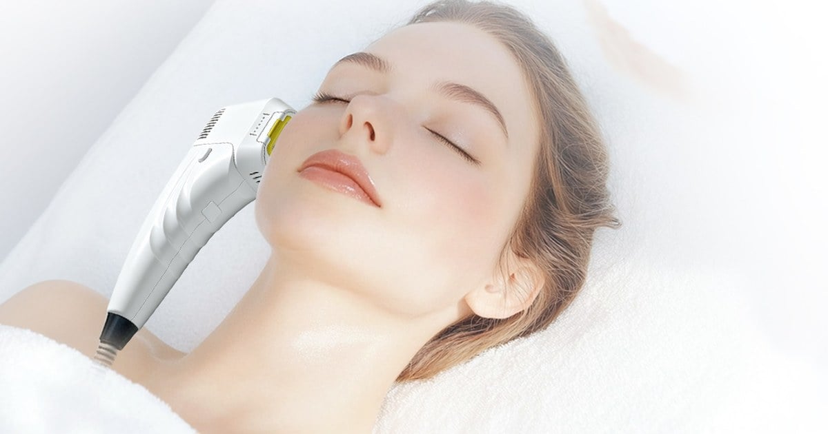 HIFU facial treatment being performed with a clinic HIFU machine handpiece